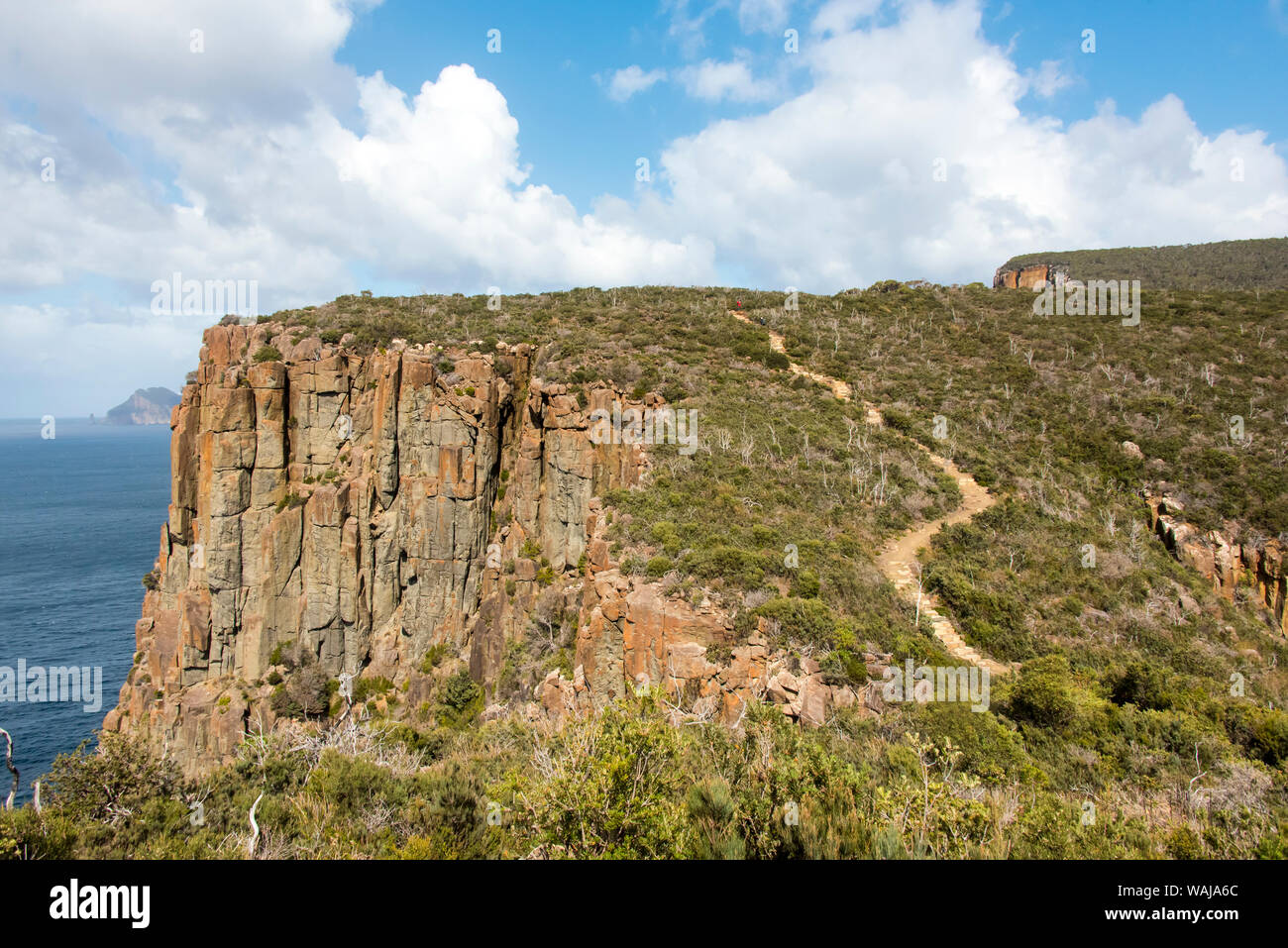 Australia, Tasmania, Tasman National Park. Hikers on Cape Hauy Three