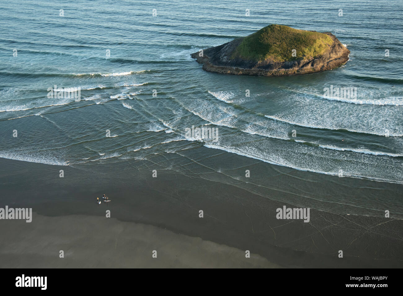 Canada, British Columbia, Pacific Rim National Park. Aerial view of surfers at Long Beach. Stock Photo