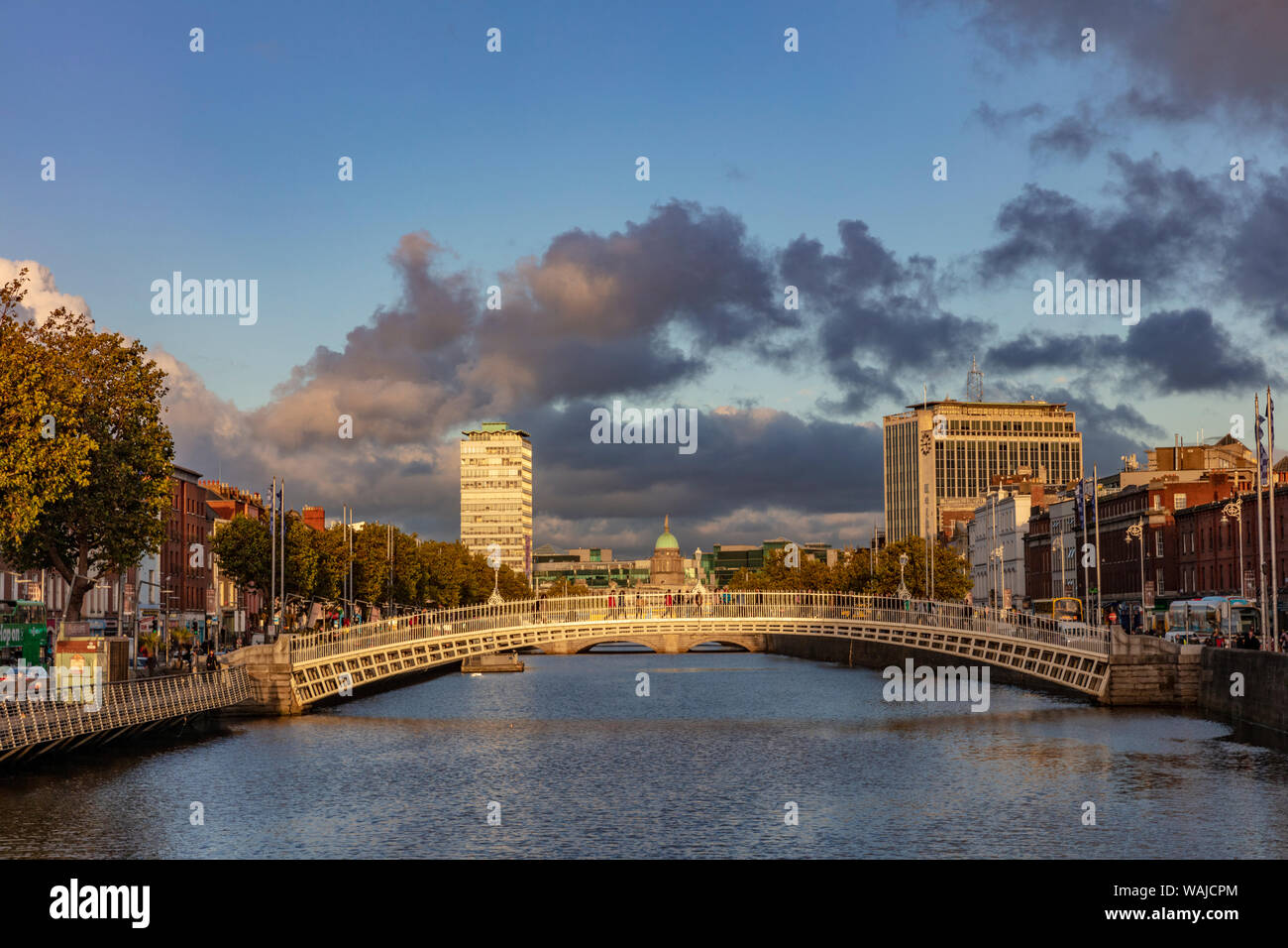 Historic Ha'Penny walking bridge over the River Liffey in Dublin ...
