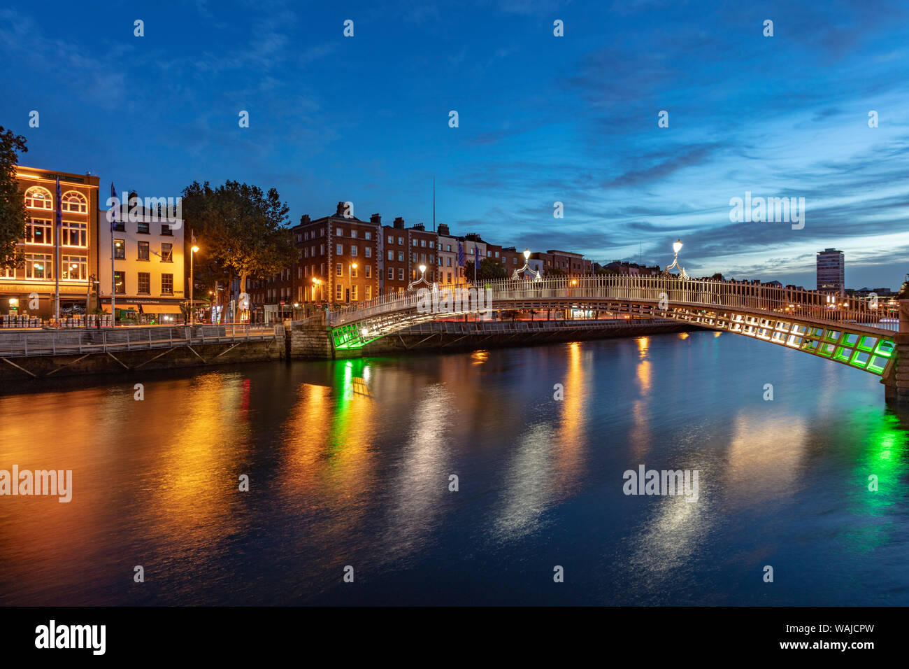 Historic Ha'Penny walking bridge over the River Liffey in Dublin ...