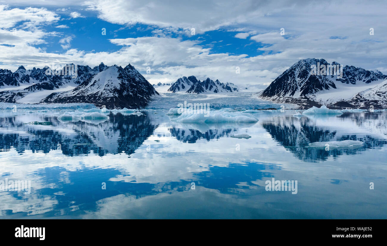 Norway, Svalbard, Spitsbergen. Monacobreen Glacier and mountain reflections. Stock Photo