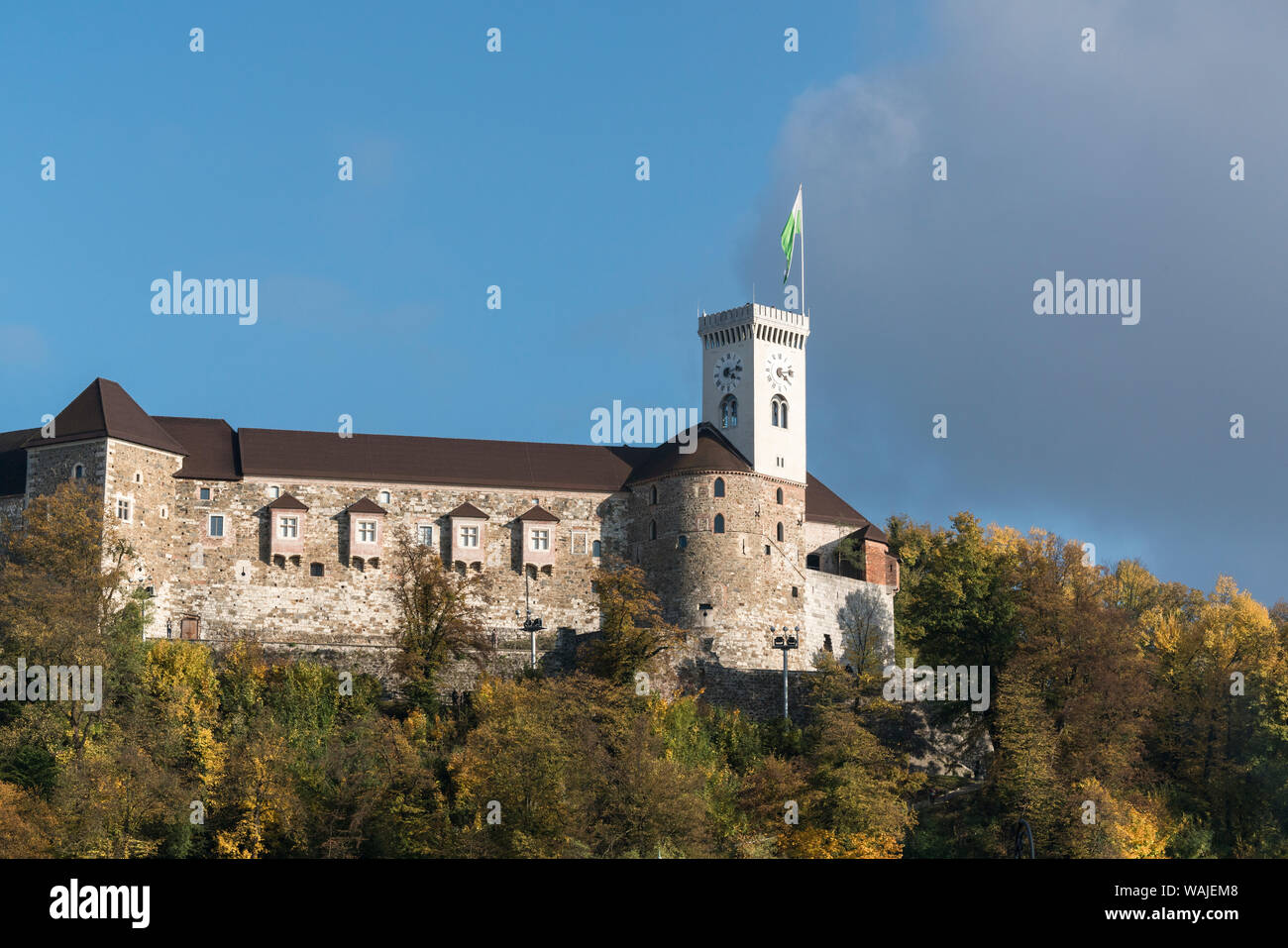 Slovenia, Ljubljana. The Castle sitting atop a rocky promontory above the city. Stock Photo