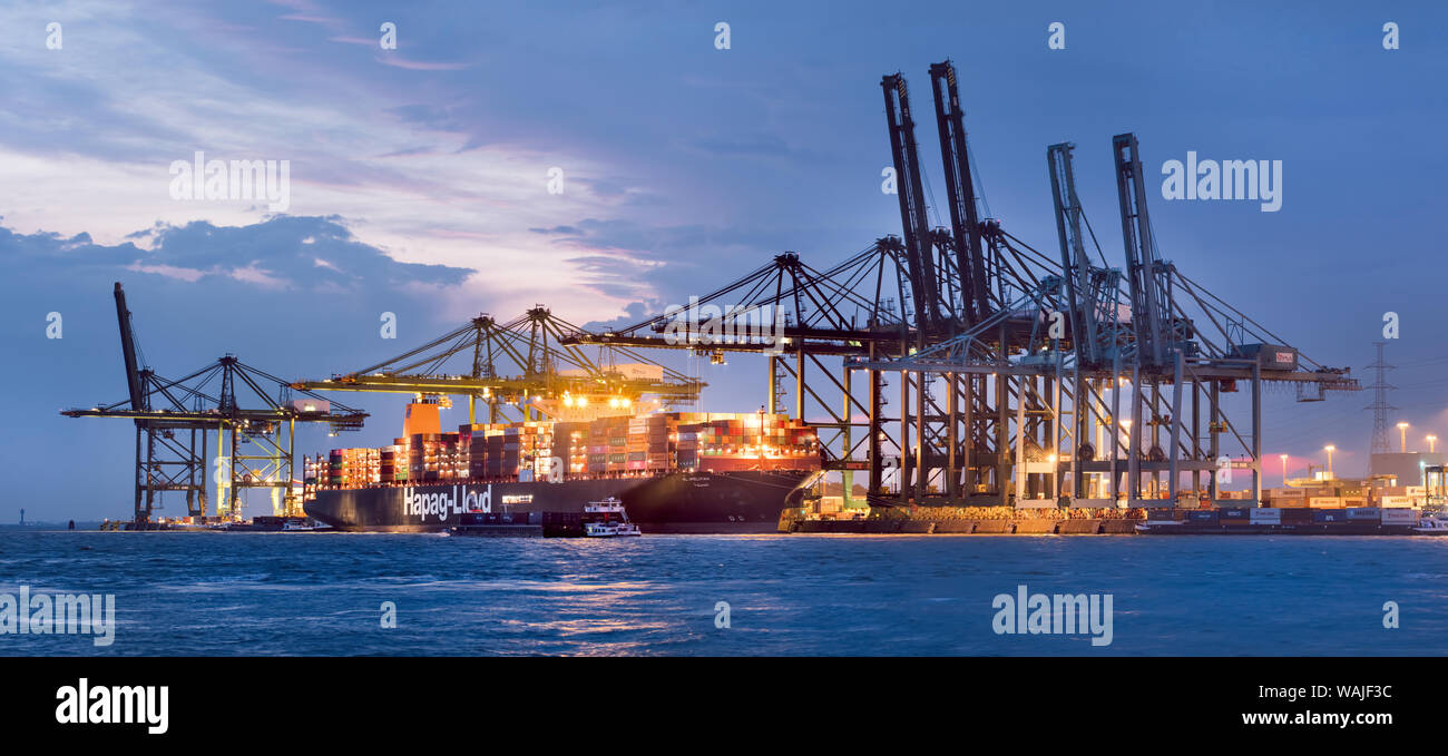 Illuminated container terminal at twilight. Thanks to its very high ...