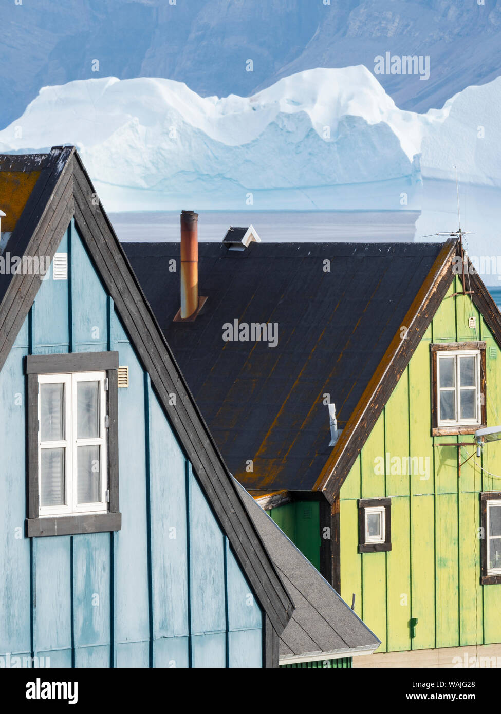 Small town of Uummannaq, northwest Greenland. Background the glaciated Nuussuaq (Nuussuaq) Peninsula. (Editorial Use Only) Stock Photo