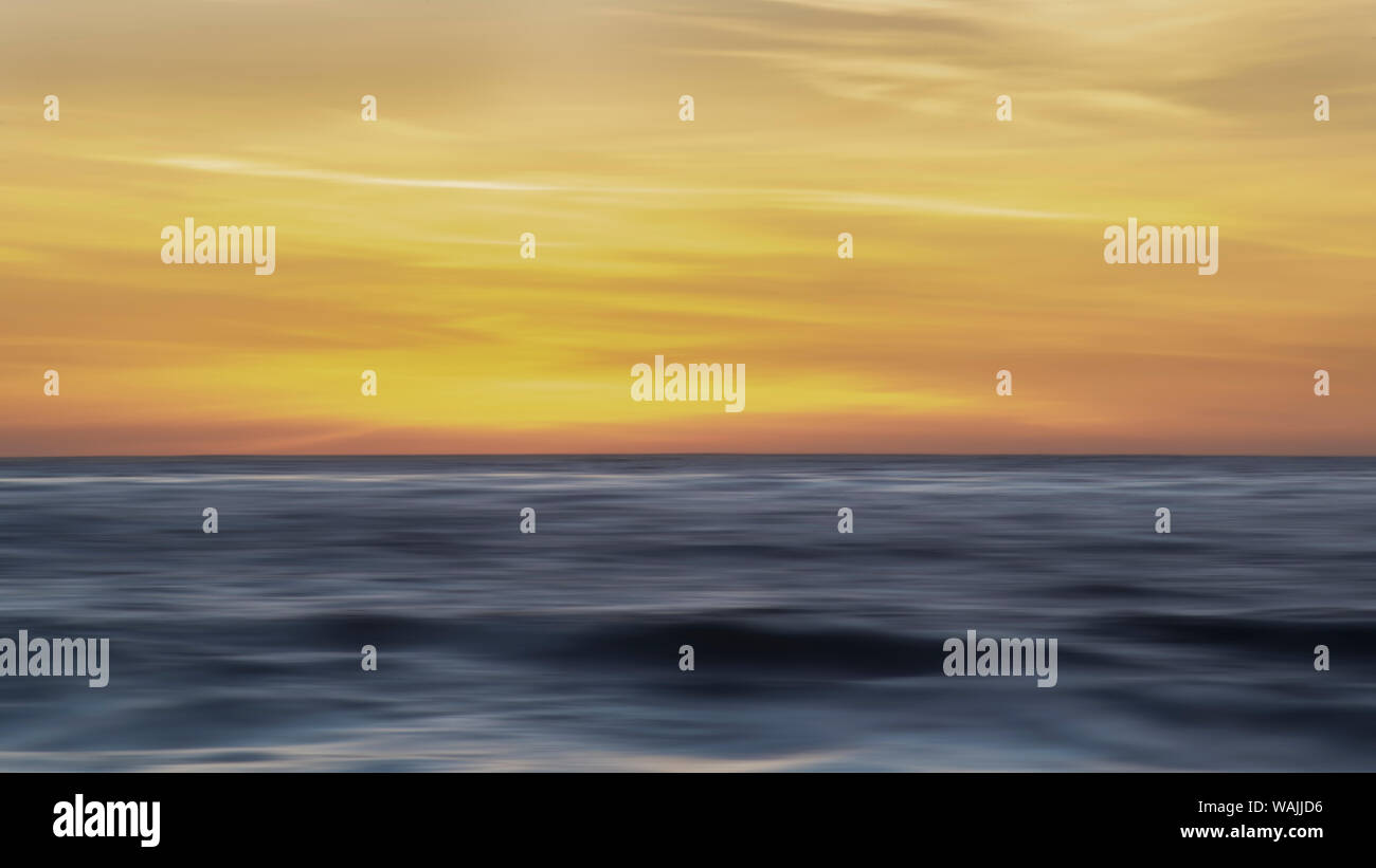 Sunset colors in the sky over the smooth ripples of the ocean Stock ...
