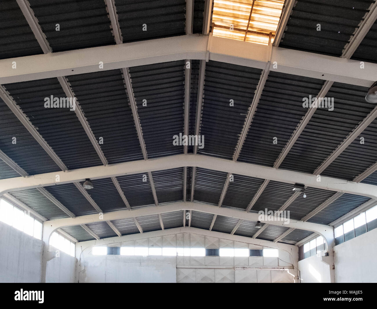 Interior of the old warehouse with clerestory on the roof. Stock Photo