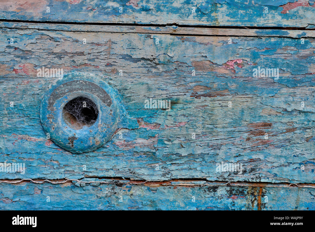 Old wooden fishing boat out of water, detail of paint. Crescent City, California. Stock Photo