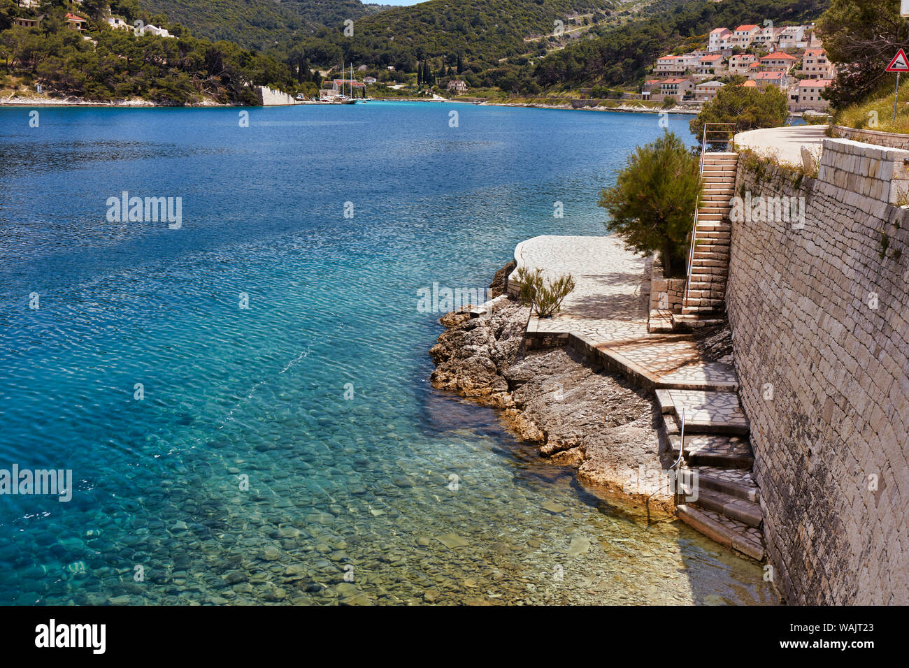 A little, stone public beach, Puscisca, Croatia Stock Photo