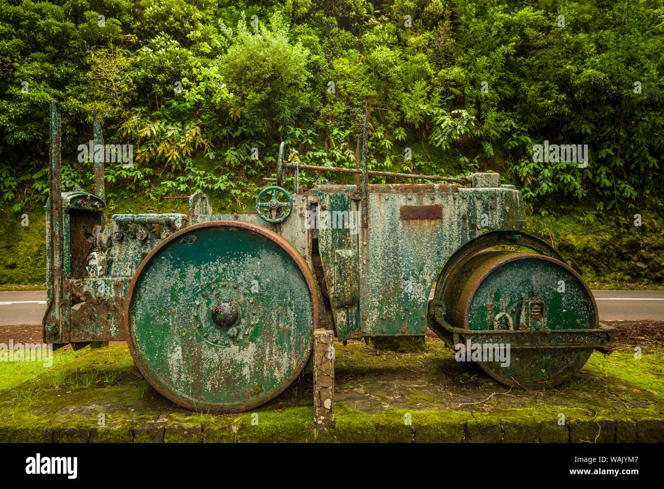 Portugal, Azores, Santa Maria Island, Pico Alto. Old steamroller used as monument to island road builders Stock Photo
