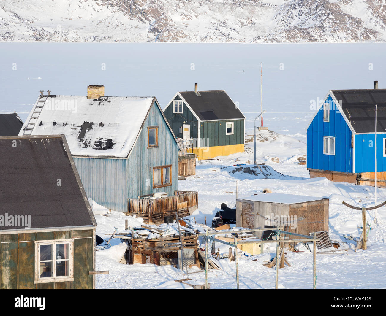 Ikerasak fishing village during winter in the Uummannaq Fjord, north of the polar circle. Greenland. Stock Photo