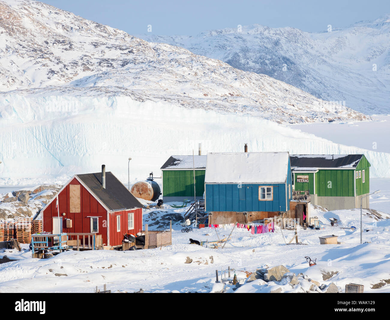 Ikerasak fishing village during winter in the Uummannaq Fjord, north of the polar circle. Greenland. Stock Photo