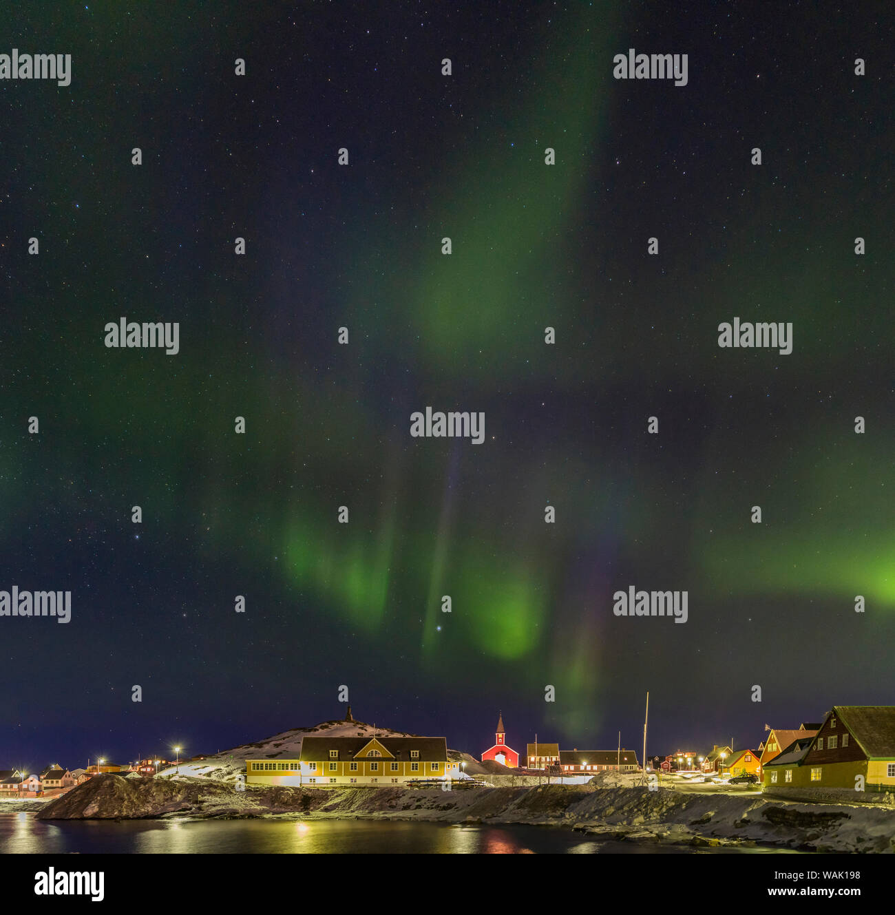 Northern Lights over the old town and colonial harbor. Nuuk, capital of Greenland. Stock Photo
