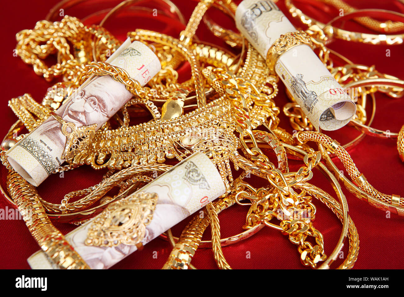 Jewelry with banknotes representing Gold Loan concept Stock Photo - Alamy