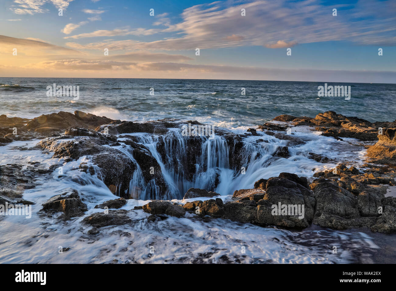Thor's Well with surf cascading into the well along the Oregon coastline Stock Photo