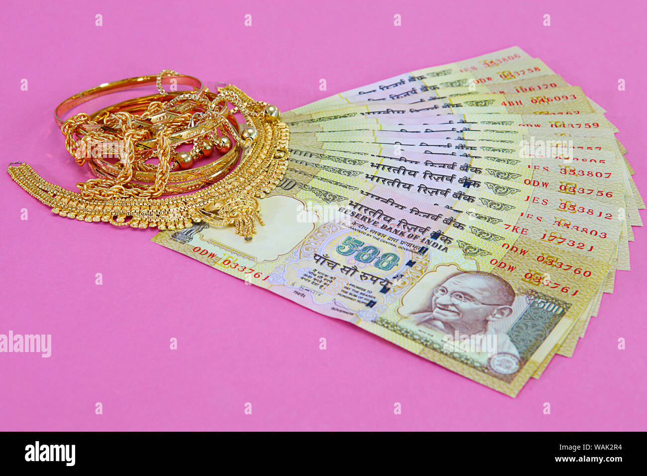 Jewelry with banknotes representing Gold Loan concept Stock Photo - Alamy