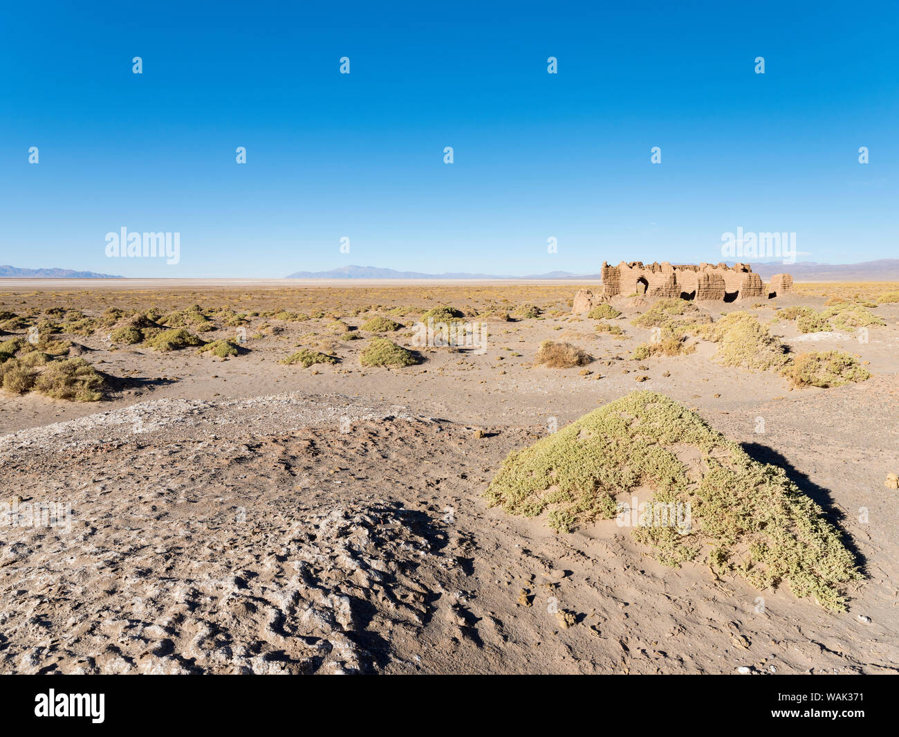 Ruins of buildings for salt processing. Landscape at the salt flats Salar Salinas Grandes in the Altiplano, Argentina. Stock Photo