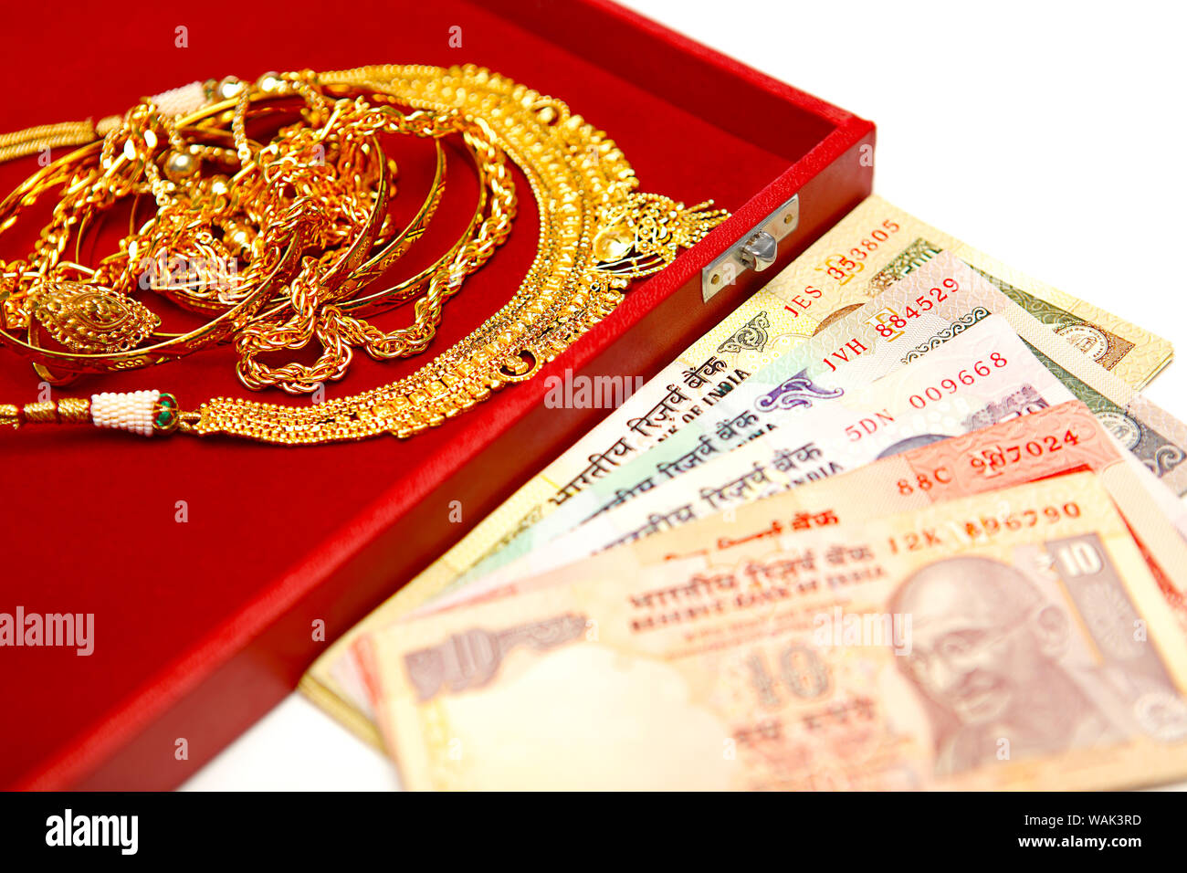 Jewelry with banknotes representing Gold Loan concept Stock Photo - Alamy