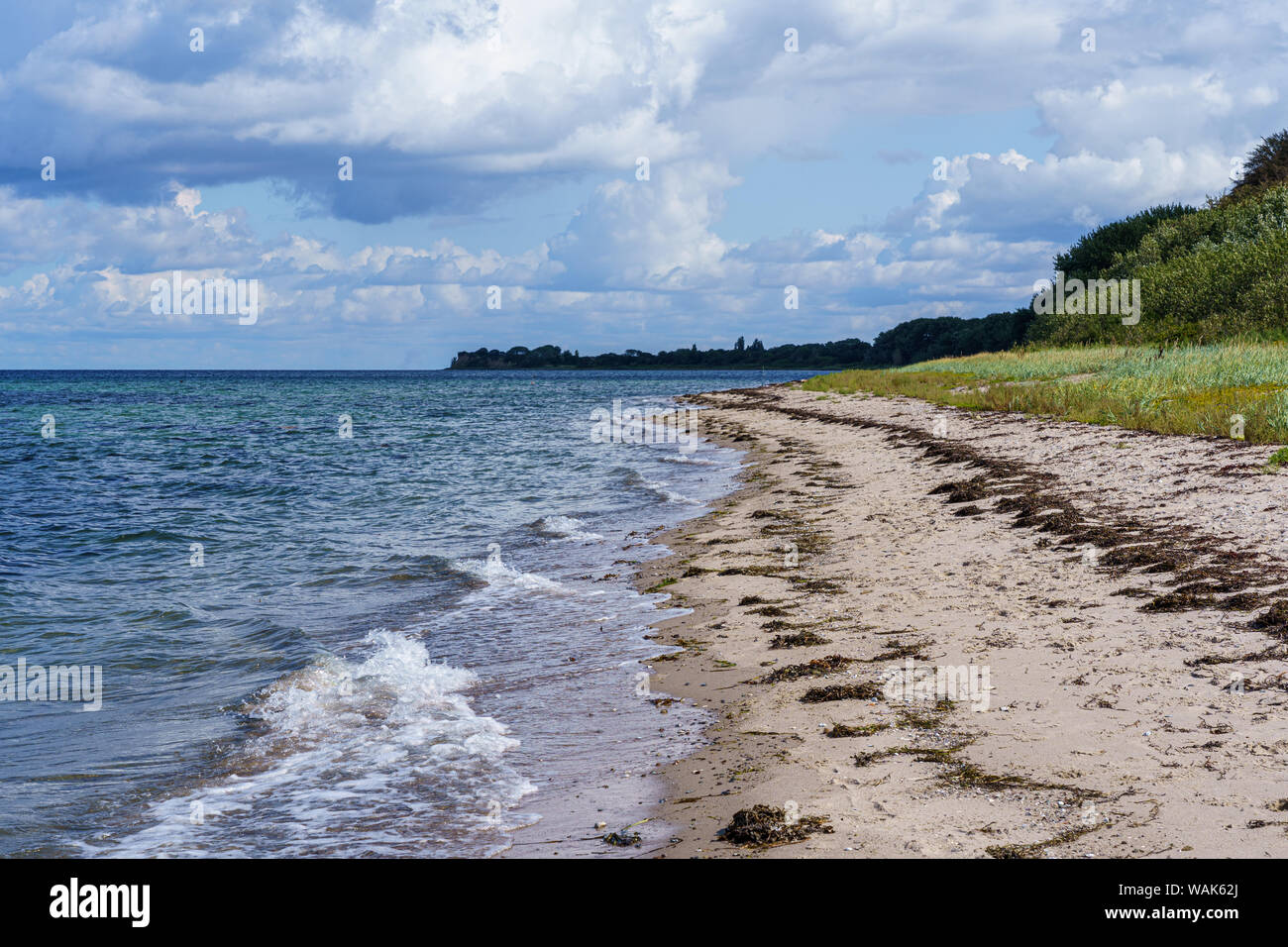 Sandy beach with waves on the Baltic Sea Stock Photo