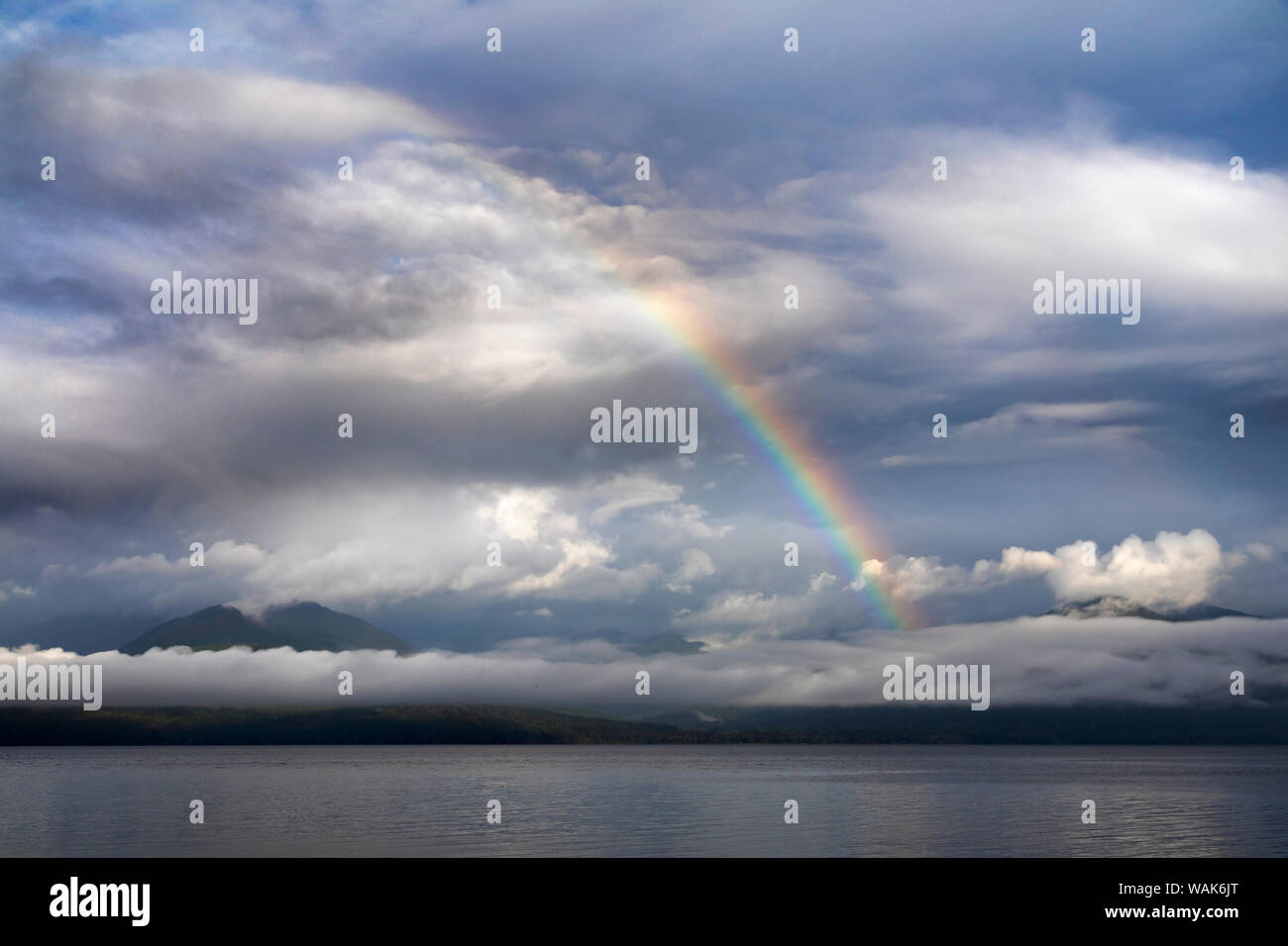 USA, Washington State, Seabeck. Rainbow over Hood Canal and Olympic Mountains. Credit as: Don Paulson / Jaynes Gallery / DanitaDelimont.com Stock Photo
