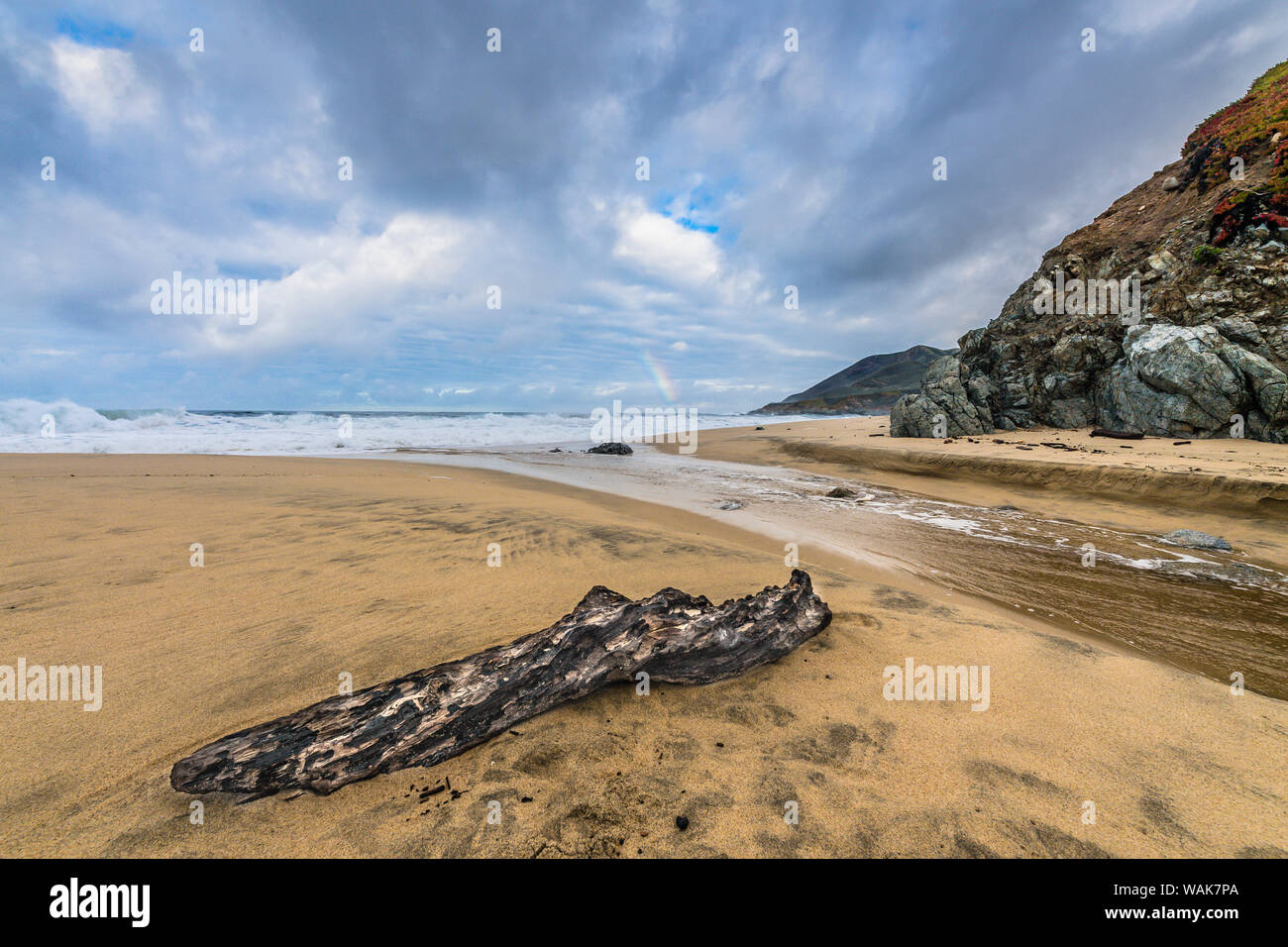 Stream flowing into the Pacific Ocean on Garrapata Beach Stock Photo