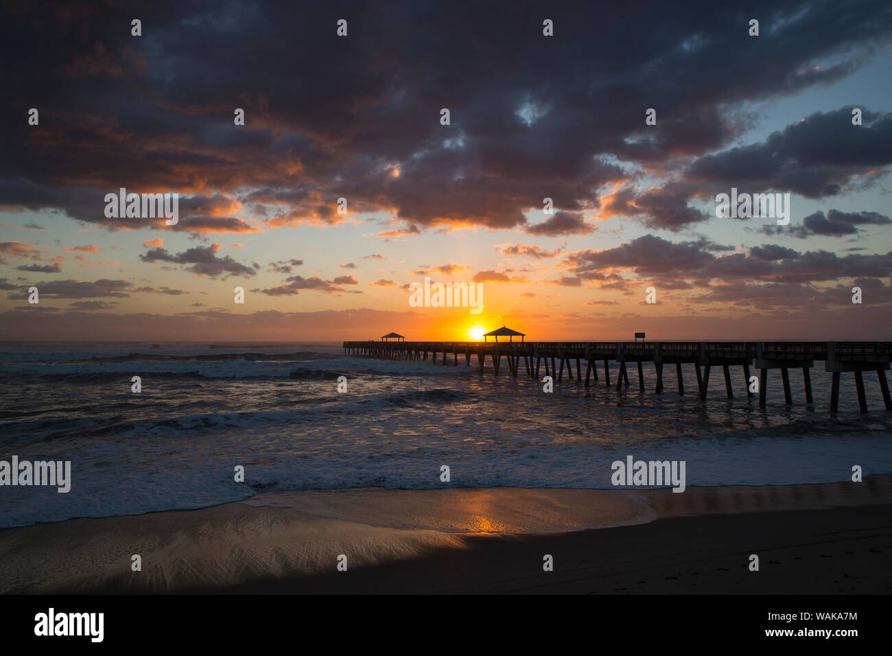 Juno Beach, Florida. Sunrise and high surf at Juno Beach Pier Stock