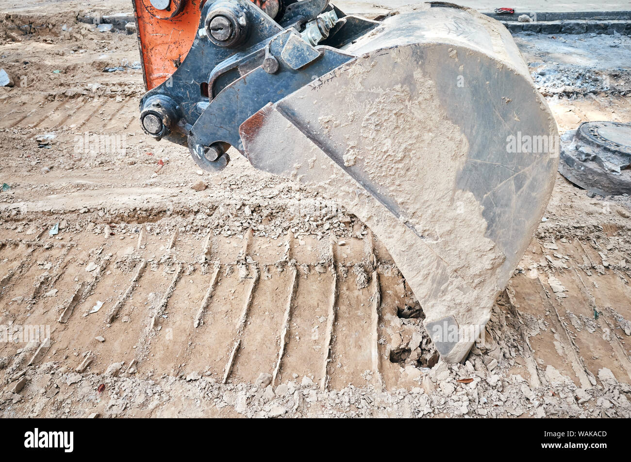 Excavator bucket digging in the dirt Stock Photo Alamy
