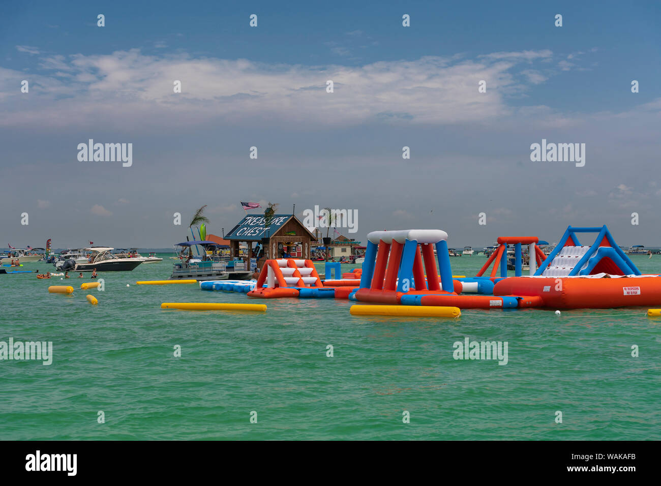 Boats and people in the waters off Fort Walton Beach, Florida, floating kiosk, and blow up playground Stock Photo