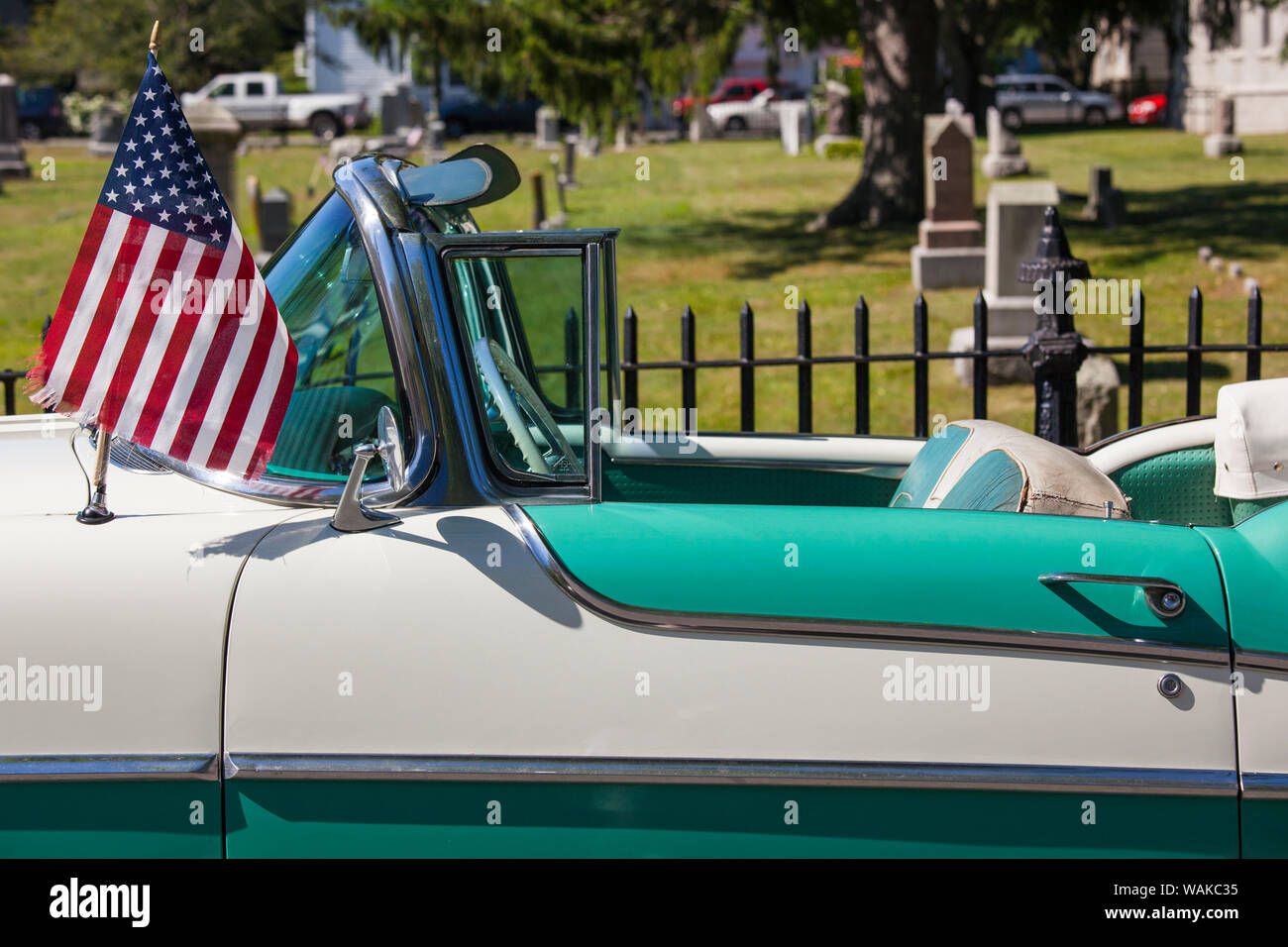 USA, Massachusetts, Cape Ann, Manchester by the Sea. Fourth of July, US flags on antique car Stock Photo