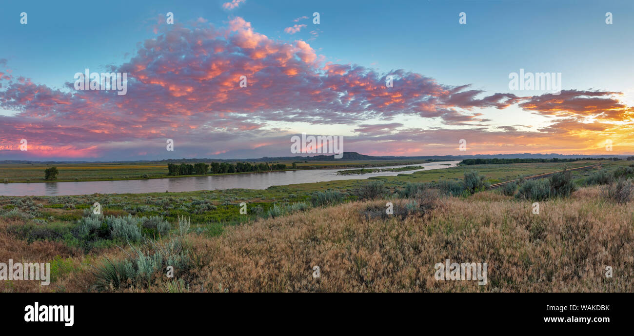 Panoramic of Sunrise clouds over the Yellowstone River at the confluence with the Powder River near Terry, Montana, USA Stock Photo