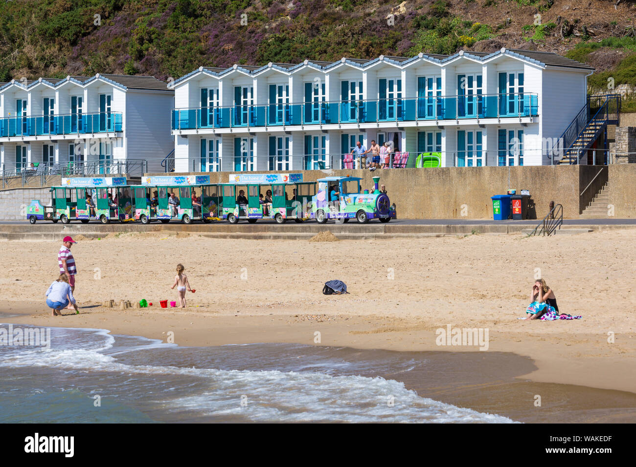 Beach and beach huts at Branksome Chine, Poole, Dorset UK on a warm sunny day in August Stock Photo