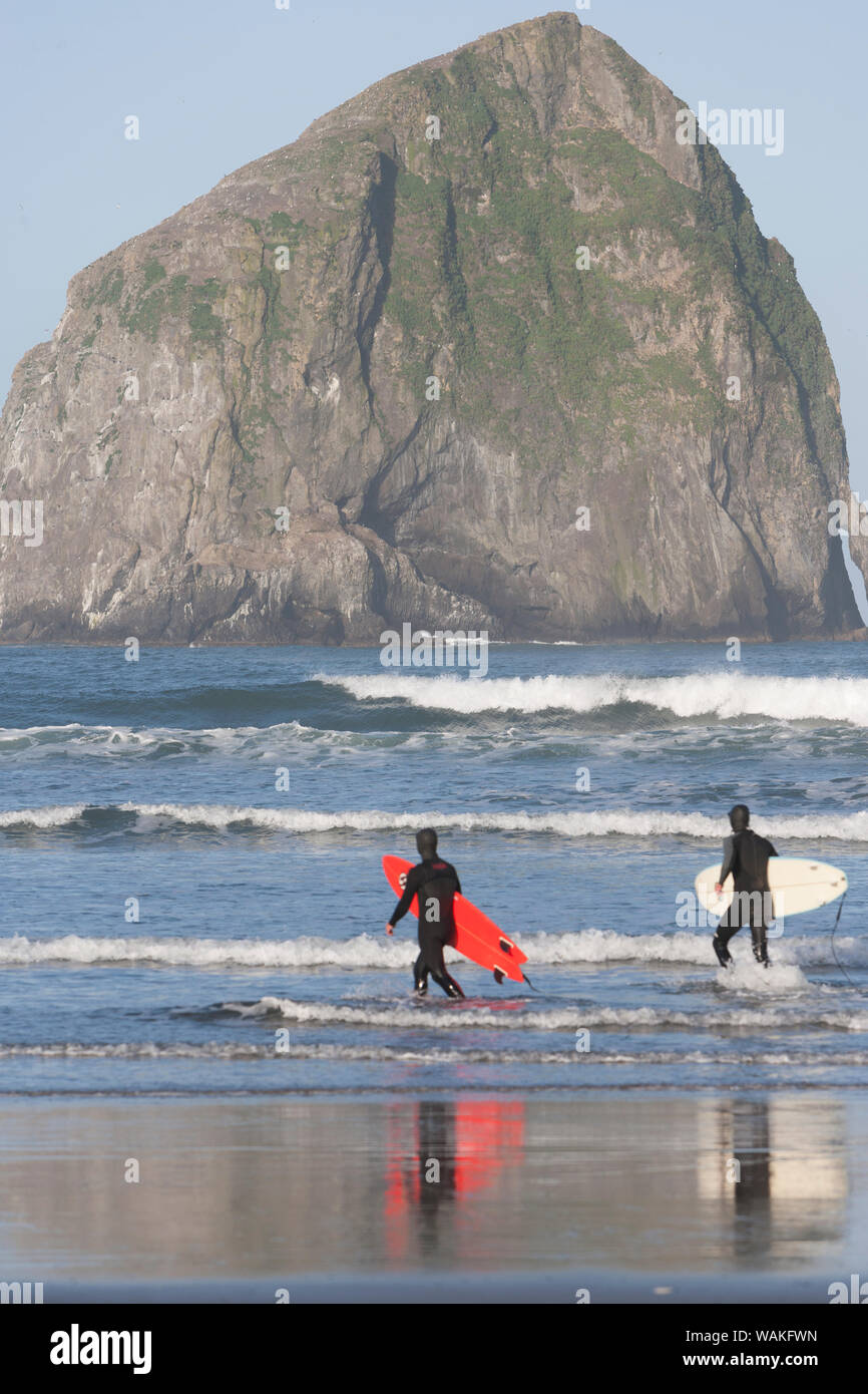 Surfers, Haystack Rock, Cape Kiwanda State Park, Oregon Coast, USA, Late Spring (Editorial Use Only) Stock Photo