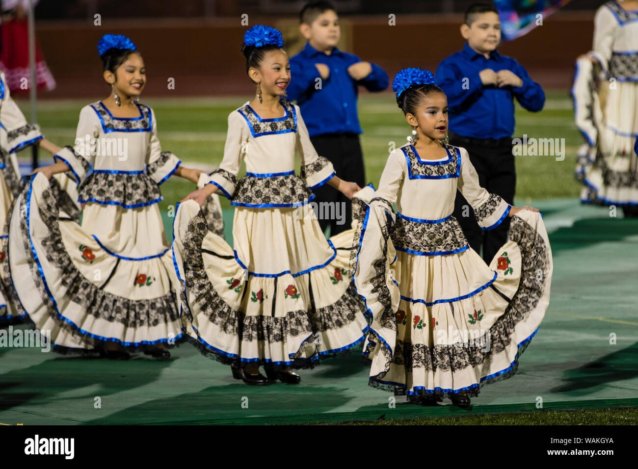 Children performing Mexican folk dance in traditional clothing. (Editorial Use Only) Stock Photo