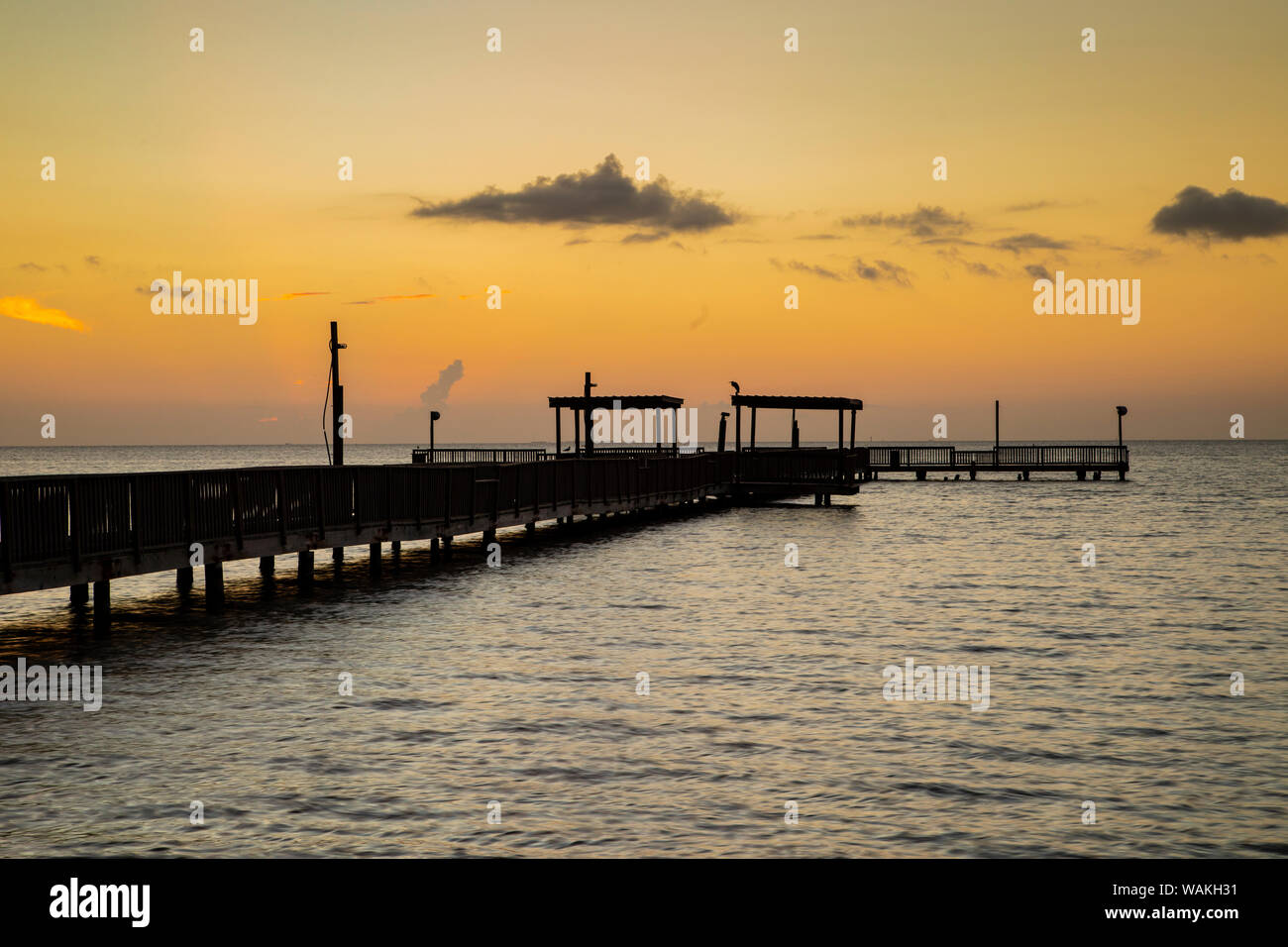 Fishing pier at sunrise. Stock Photo