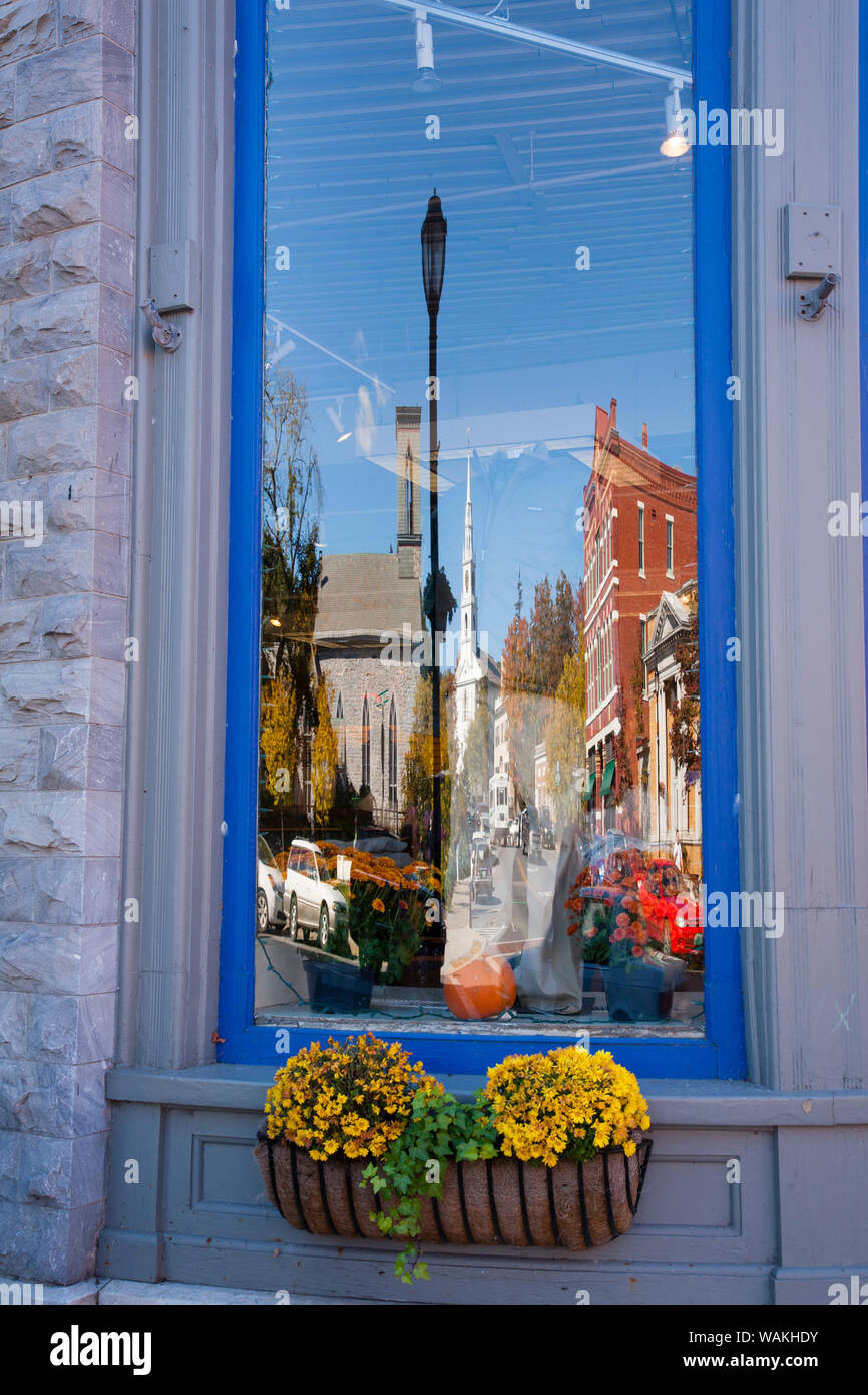 Reflection of small town in Vermont in window. Stock Photo