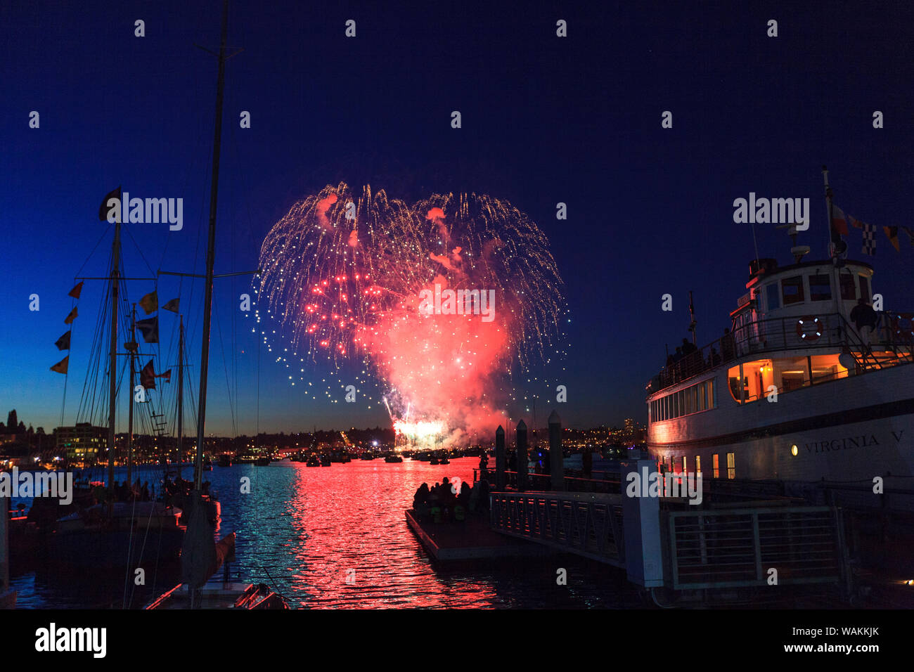 4th of July Fireworks silhouette Classic Wooden Boats, Lake Union July 4th Celebration, Seattle, Washington State, USA Stock Photo