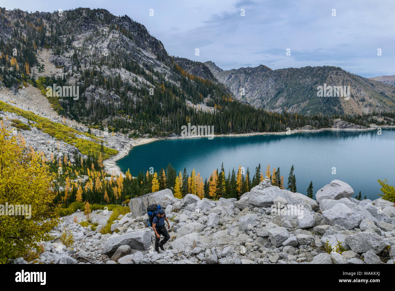 USA, Washington State, Alpine Lakes Wilderness. Backpacker starts up