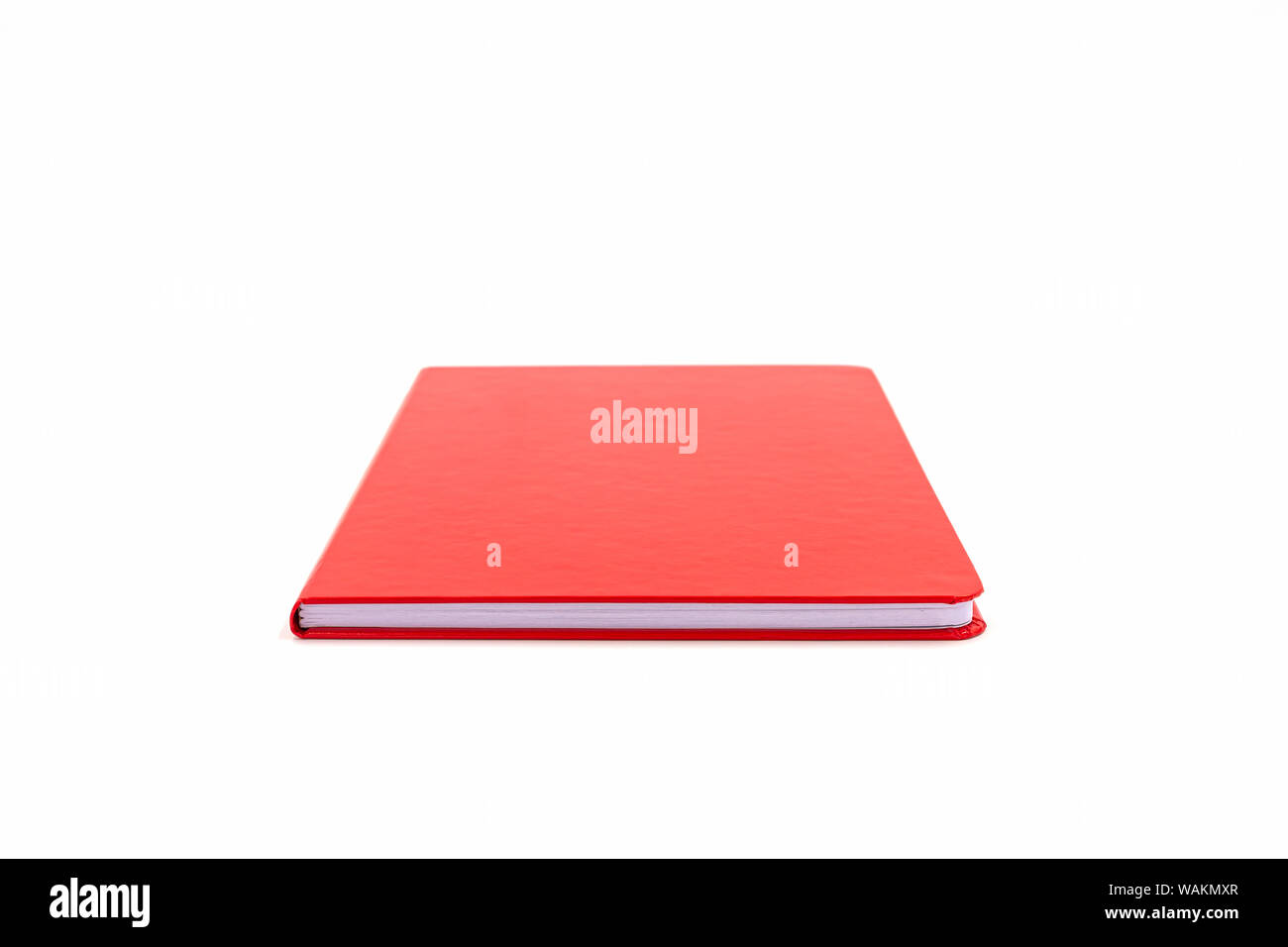 Close up red leather notebook isolated on white background. Stock Photo