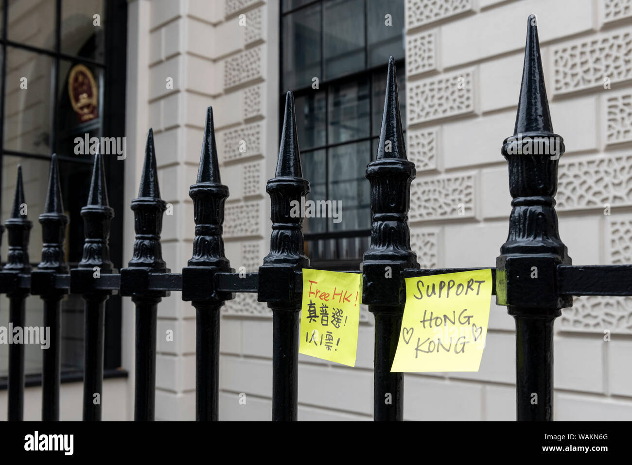 People protest outside the Chinese Embassy in London against the violent suppression of protests in Hong Kong. With a hired red London routemaster bus Stock Photo