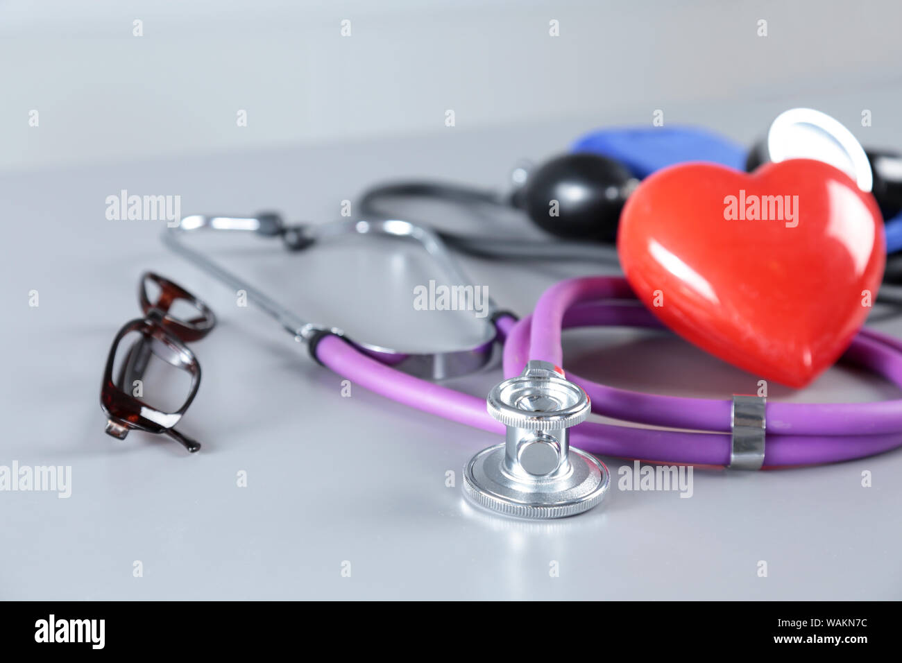 Red heart and a stethoscope on white background Stock Photo - Alamy