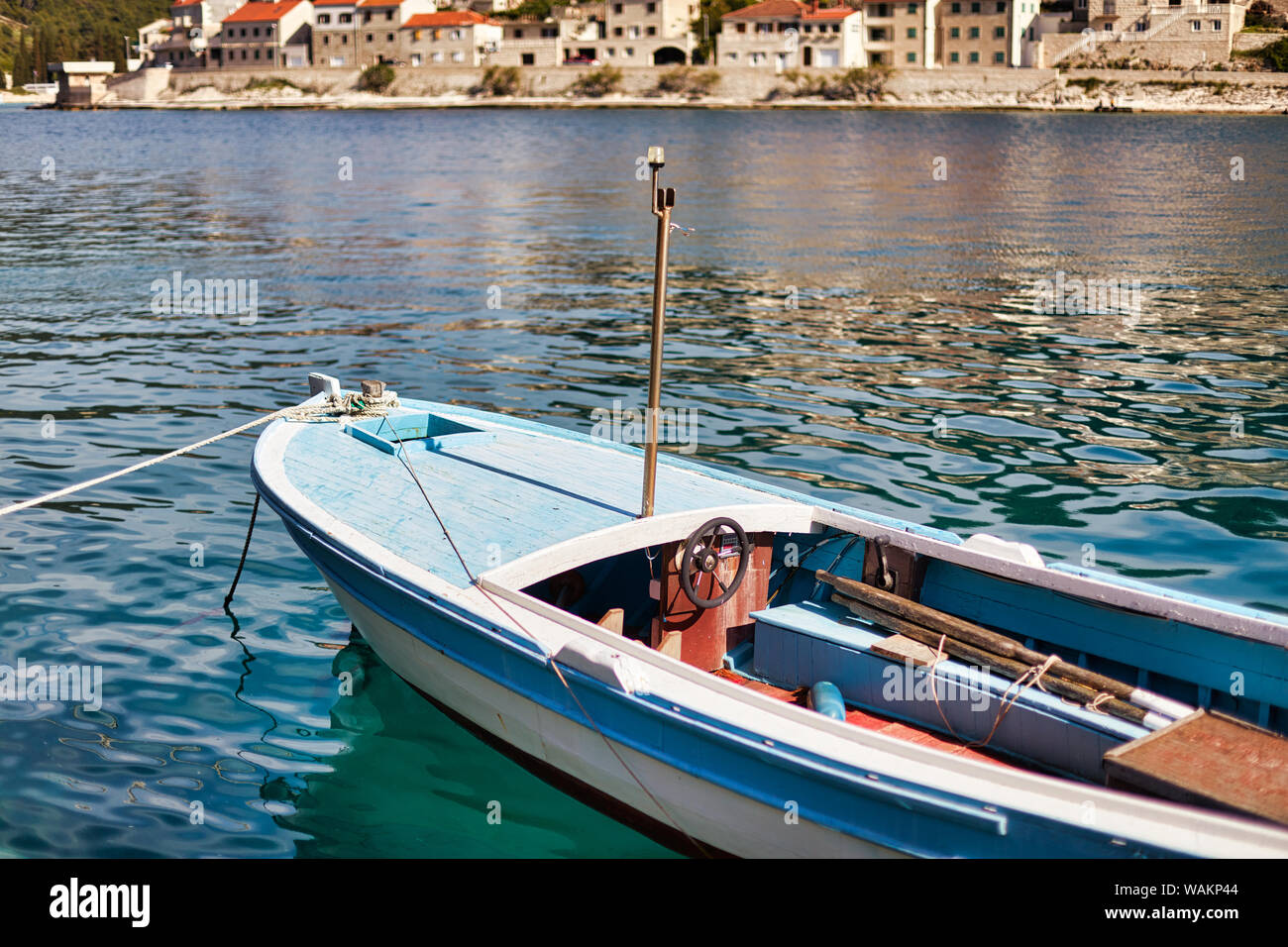 Pucisca, Brac Island, Croatia. Traditional fishing boat in the port. View of the city. The city famous from the sandstone from which the White House w Stock Photo