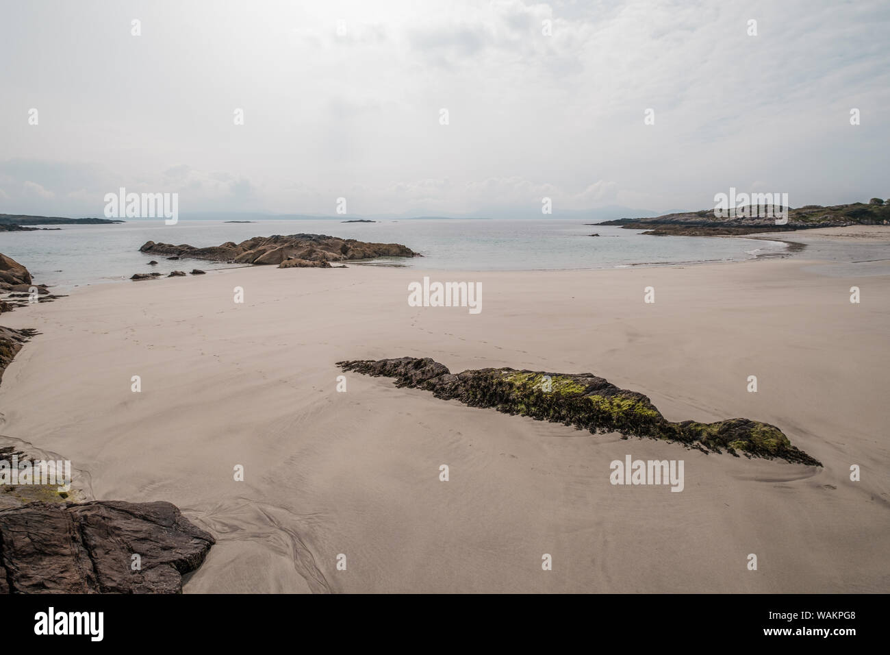 Rocks and a small sandy beach at O'Carroll's Cove near Castlecove on