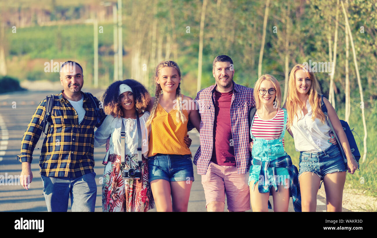Group of happy multiracial friends having fun together bonding outdoors Stock Photo