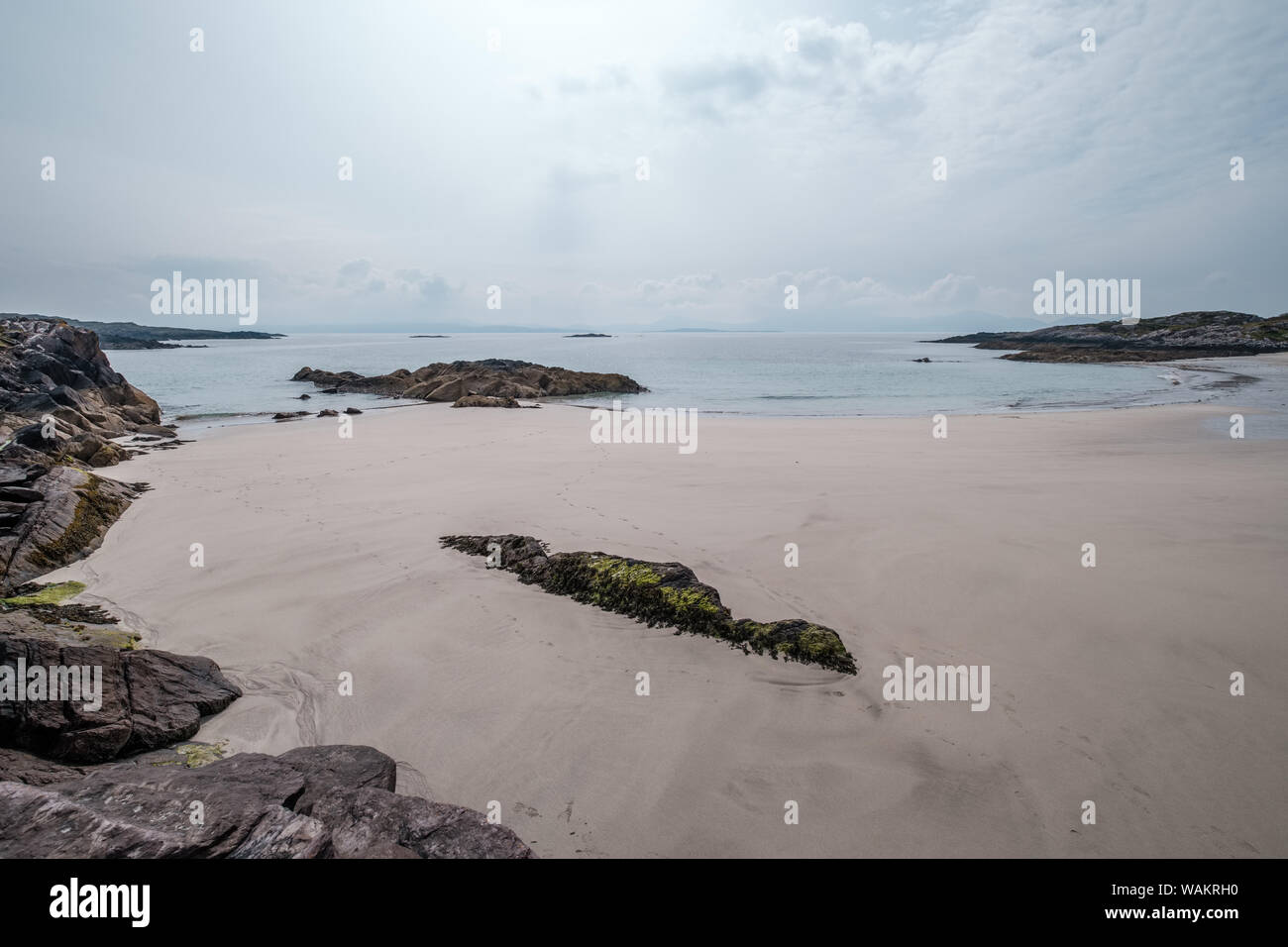 Rocks and a small sandy beach at O'Carroll's Cove near Castlecove on