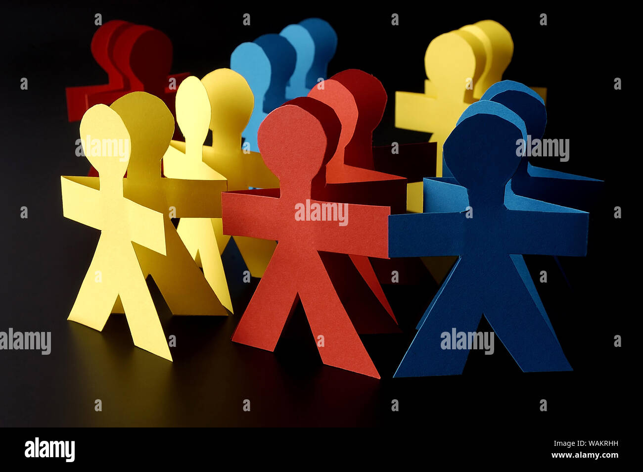 Red blue and yellow paper men isolated Stock Photo