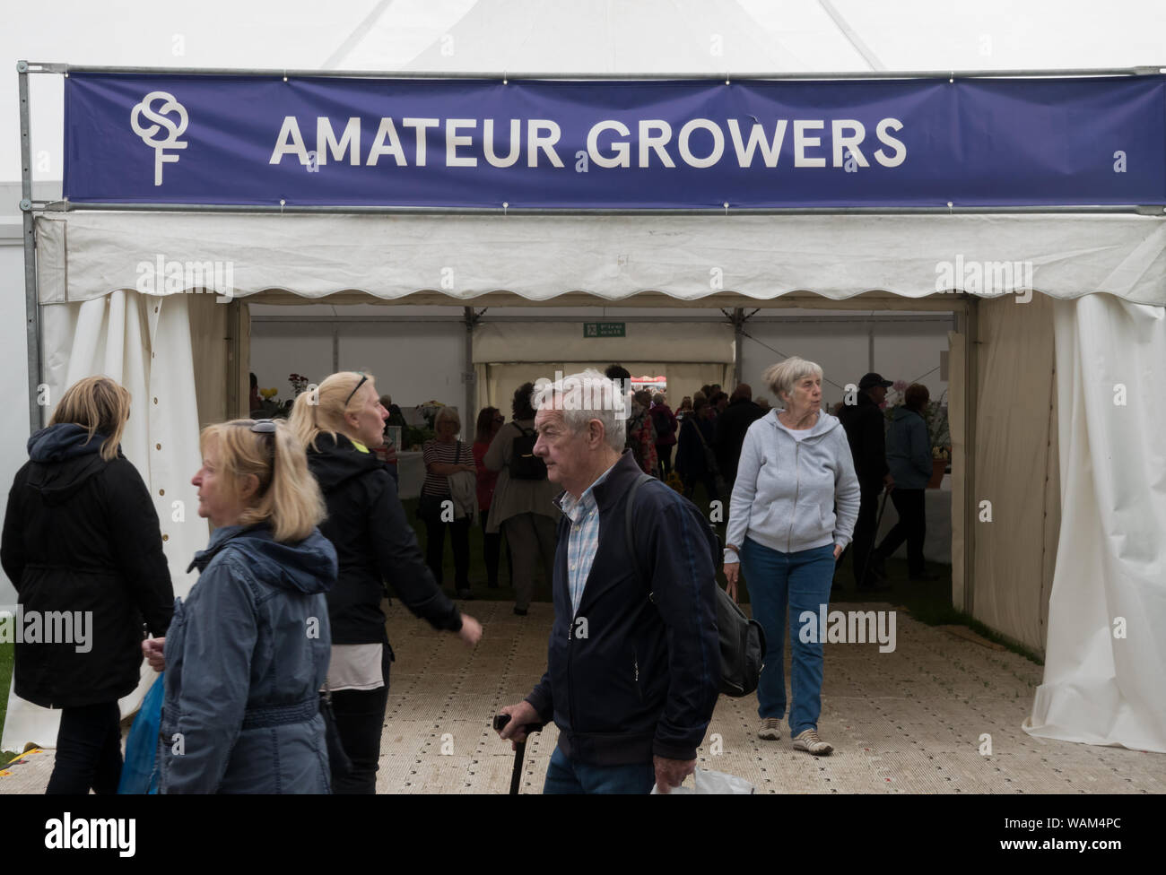 People entering and leaving the Amateur Growers marque at the 2019 Southport Flower Show. Stock Photo