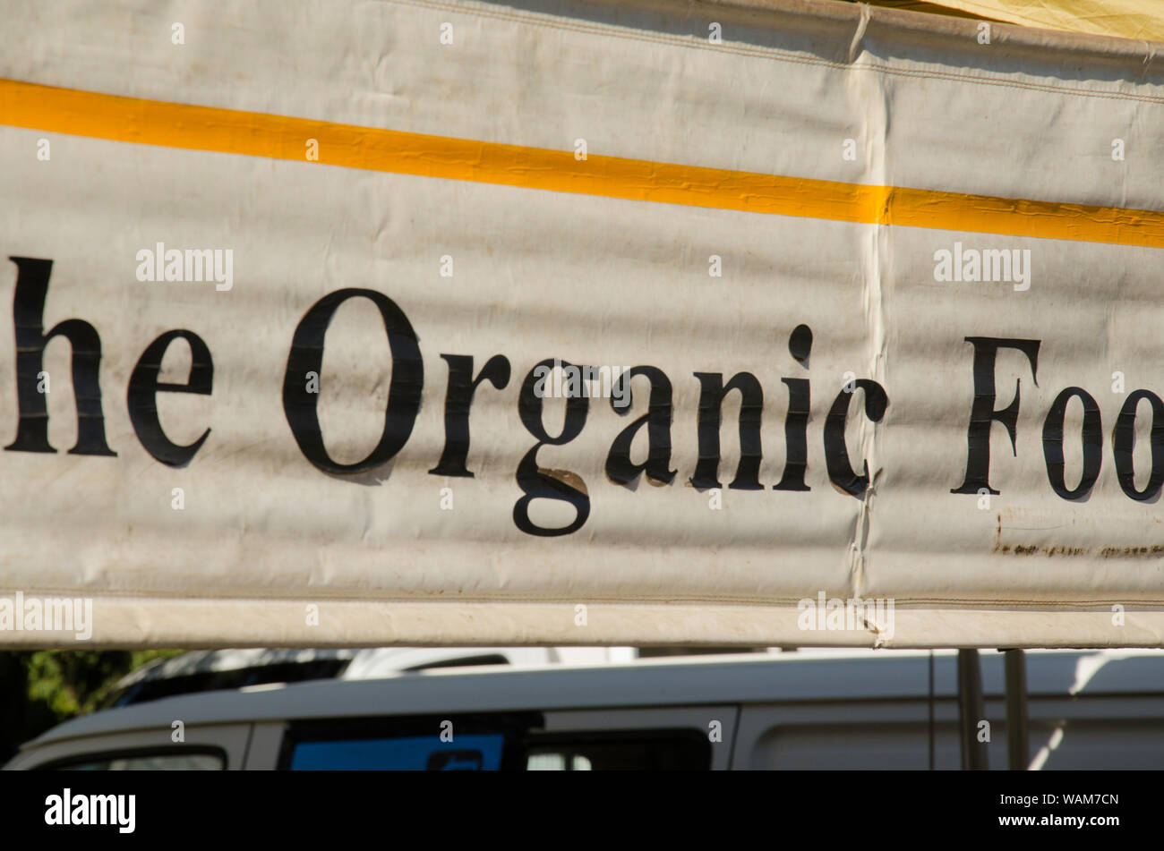 The word Organic written in large black lettering on a banner sign at a weekend food market in Sydney, Australia Stock Photo