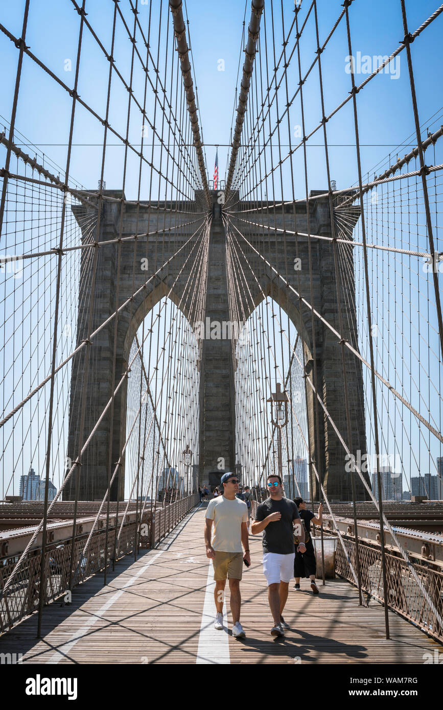 Brooklyn Bridge, View In Summer Of Young People Walking Across The ...