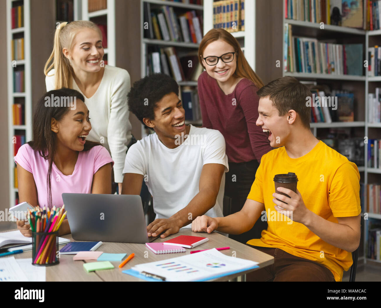 Enthusiastic teenager sharing his ideas with classmates Stock Photo