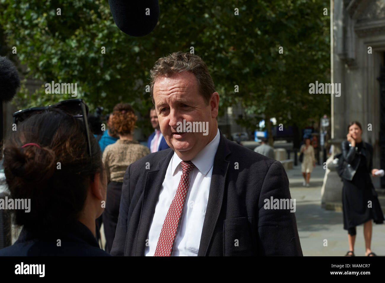 Royal Courts of Justice, London, UK. 21st August, 2019.  Ealing Council's safe zone upheld after Court of Appeal hearing at the Royal Courts of Justice.  Leader of  Ealing council Julian Bell talks to the press after the hearing    Credit: Thomas Bowles/ Alamy Live News Stock Photo