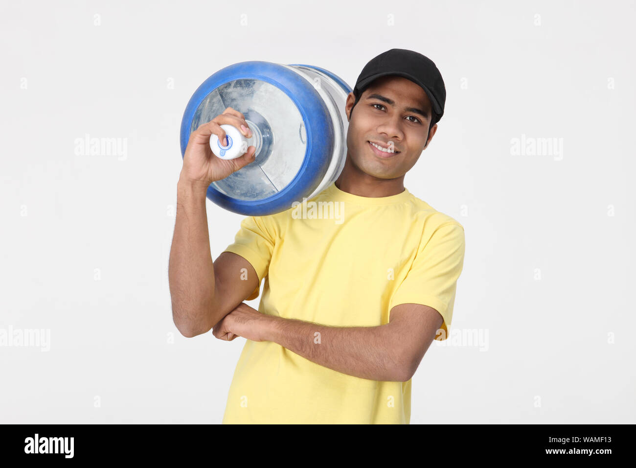 https://c8.alamy.com/comp/WAMF13/delivery-man-carrying-water-bottle-WAMF13.jpg